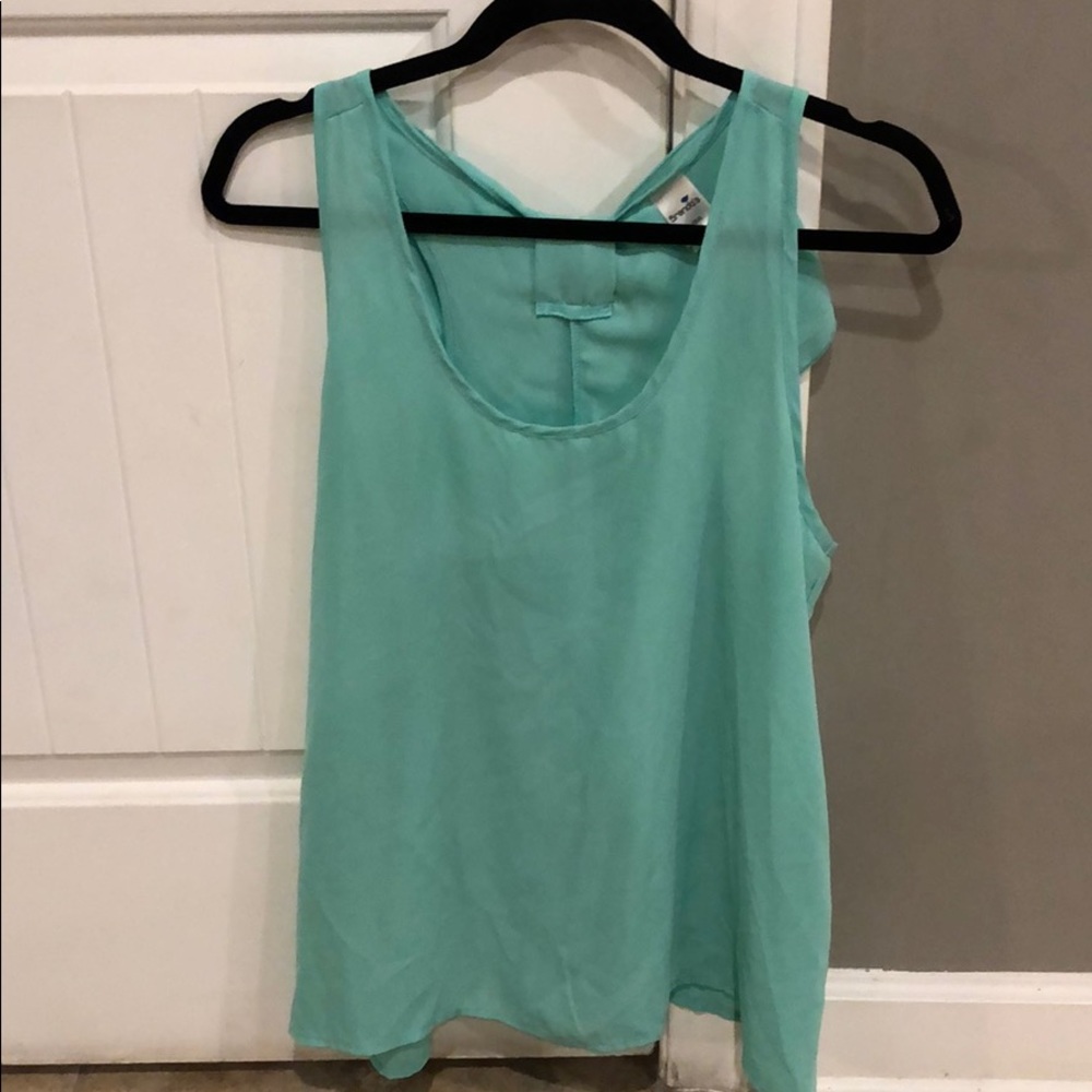 Teal sheer tank with bow accent on back